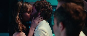 Movie still from “Popstar: Never Stop Never Stopping” (2016), directed by Akiva Schaffer – A man and a woman kissing each other in front of a crowd; Close Up shot, Over the shoulder angle
