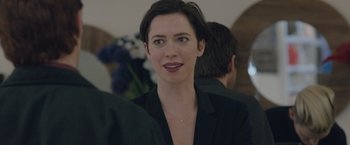 Movie still from “The Gift” (2015), directed by Joel Edgerton – A person with short hair wearing a suit; Close Up shot, Over the shoulder angle