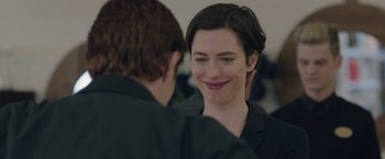 Movie still from “The Gift” (2015), directed by Joel Edgerton – A woman smiles at a man in a black shirt; Close Up shot, Over the shoulder angle