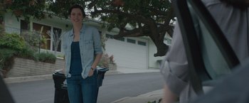 Movie still from “The Gift” (2015), directed by Joel Edgerton – A woman standing on the side of the street; Medium shot, Over the shoulder angle