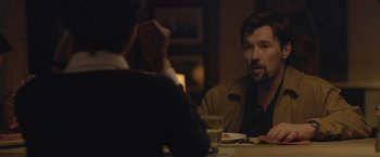 Movie still from “The Gift” (2015), directed by Joel Edgerton – A man sitting at a table in front of another man; Close Up shot, Over the shoulder angle