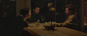 Movie still from “The Gift” (2015), directed by Joel Edgerton – A man and a woman sitting at a dinner table; Medium shot, Over the shoulder angle