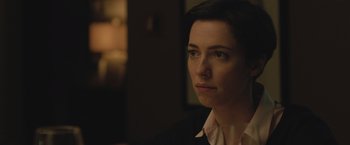 Movie still from “The Gift” (2015), directed by Joel Edgerton – A person wearing a suit and tie; Close Up shot, Over the shoulder angle