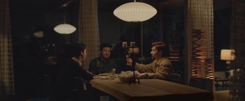 Movie still from “The Gift” (2015), directed by Joel Edgerton – A group of people sitting at a table with wine glasses; Medium shot, Over the shoulder angle