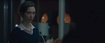 Movie still from “The Gift” (2015), directed by Joel Edgerton – A woman standing in front of a mirror in front of a window; Close Up shot, Over the shoulder angle