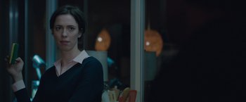 Movie still from “The Gift” (2015), directed by Joel Edgerton – A woman standing in front of a window at night; Close Up shot, Over the shoulder angle