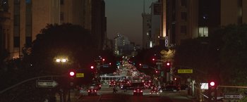Movie still from “The Gift” (2015), directed by Joel Edgerton – A city street filled with lots of traffic at night; Extreme Wide shot, High angle