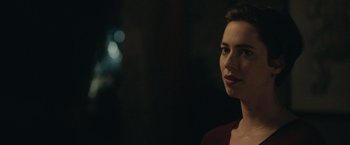 Movie still from “The Gift” (2015), directed by Joel Edgerton – A beautiful woman standing in front of a window at night; Close Up shot, Over the shoulder angle