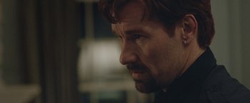 Movie still from “The Gift” (2015), directed by Joel Edgerton – A person with a beard; Close Up shot, Over the shoulder angle