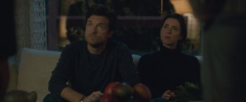 Movie still from “The Gift” (2015), directed by Joel Edgerton – A man and a woman sitting next to each other; Medium shot, Over the shoulder angle
