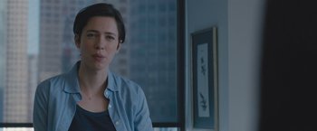 Movie still from “The Gift” (2015), directed by Joel Edgerton – A woman standing in front of a window in a room; Close Up shot, Over the shoulder angle