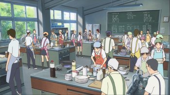 Movie still from “The Girl Who Leapt Through Time” (2006), directed by Mamoru Hosoda – A group of people standing around a kitchen; Extreme Wide shot, High angle