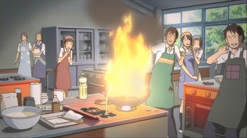 Movie still from “The Girl Who Leapt Through Time” (2006), directed by Mamoru Hosoda – A group of people standing in a kitchen cooking; Medium shot, High angle