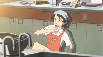 Movie still from “The Girl Who Leapt Through Time” (2006), directed by Mamoru Hosoda – A woman sitting in a kitchen making a funny face; Medium shot, High angle