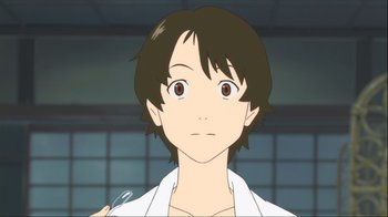 Movie still from “The Girl Who Leapt Through Time” (2006), directed by Mamoru Hosoda – A young man with short brown hair wearing a white shirt; Close Up shot, Low angle