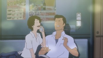 Movie still from “The Girl Who Leapt Through Time” (2006), directed by Mamoru Hosoda – A man and a woman talking on a cell phone; Medium shot, Low angle