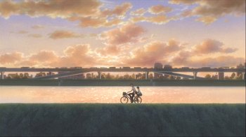 Movie still from “The Girl Who Leapt Through Time” (2006), directed by Mamoru Hosoda – Two people on a bike on the side of a river; Extreme Wide shot, Low angle