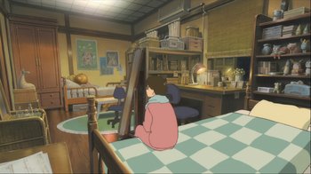 Movie still from “The Girl Who Leapt Through Time” (2006), directed by Mamoru Hosoda – An animated scene of a child sitting on a table; Wide shot, High angle