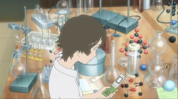 Movie still from “The Girl Who Leapt Through Time” (2006), directed by Mamoru Hosoda – A boy is holding a cell phone in his hand; Medium shot, High angle