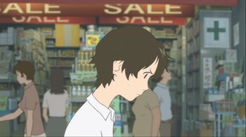 Movie still from “The Girl Who Leapt Through Time” (2006), directed by Mamoru Hosoda – A person standing in a store with a sale sign in the background; Close Up shot, Over the shoulder angle