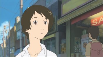 Movie still from “The Girl Who Leapt Through Time” (2006), directed by Mamoru Hosoda – A person standing in front of a building; Close Up shot, Low angle