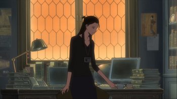 Movie still from “The Girl Who Leapt Through Time” (2006), directed by Mamoru Hosoda – A woman standing in front of computers in a room; Medium shot, Over the shoulder angle