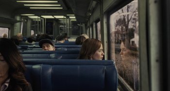 Movie still from “The Girl on the Train” (2016), directed by Tate Taylor – A man and a woman on a train looking out the window; Medium shot, Over the shoulder angle