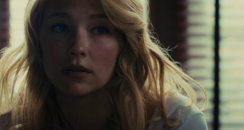 Movie still from “The Girl on the Train” (2016), directed by Tate Taylor – A person with blonde hair and blue eyes; Close Up shot, Over the shoulder angle