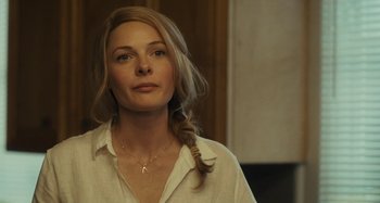 Movie still from “The Girl on the Train” (2016), directed by Tate Taylor – A woman in a white shirt with a braid in her hair; Close Up shot, Over the shoulder angle