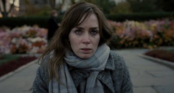 Movie still from “The Girl on the Train” (2016), directed by Tate Taylor – A person wearing a jacket and a scarf; Close Up shot, Over the shoulder angle