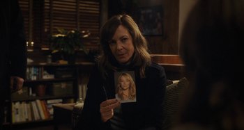 Movie still from “The Girl on the Train” (2016), directed by Tate Taylor – A woman holding up a picture of a woman; Close Up shot, Over the shoulder angle