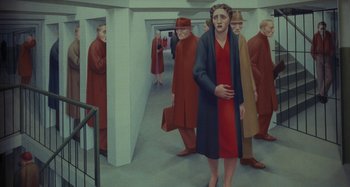 Movie still from “The Girl on the Train” (2016), directed by Tate Taylor – A painting of a woman in a red and black dress; Wide shot, High angle