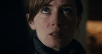 Movie still from “The Girl on the Train” (2016), directed by Tate Taylor – A woman's face with a scarf around her neck; Close Up shot, Over the shoulder angle