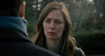 Movie still from “The Girl on the Train” (2016), directed by Tate Taylor – A person looking sad; Close Up shot, Over the shoulder angle