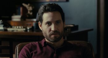 Movie still from “The Girl on the Train” (2016), directed by Tate Taylor – A person sitting in a chair; Close Up shot, Over the shoulder angle