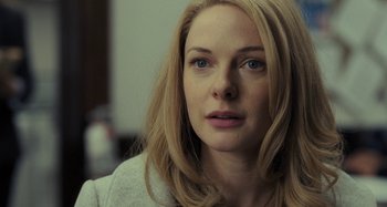 Movie still from “The Girl on the Train” (2016), directed by Tate Taylor – A person with blonde hair; Close Up shot, Over the shoulder angle