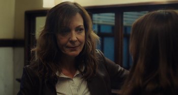 Movie still from “The Girl on the Train” (2016), directed by Tate Taylor – A person wearing a jacket; Close Up shot, Over the shoulder angle