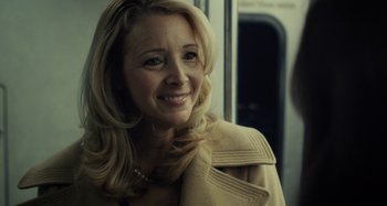 Movie still from “The Girl on the Train” (2016), directed by Tate Taylor – A woman with blonde hair wearing a beige coat; Close Up shot, Over the shoulder angle