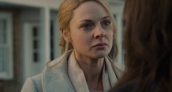 Movie still from “The Girl on the Train” (2016), directed by Tate Taylor – A person wearing a jacket; Close Up shot, Over the shoulder angle