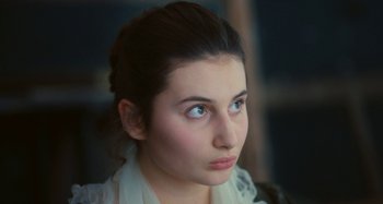 Movie still from “Portrait of a Lady on Fire” (2019), directed by Céline Sciamma – A person with blue eyes; Close Up shot, High angle