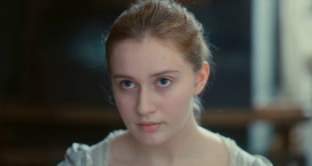 Movie still from “Portrait of a Lady on Fire” (2019), directed by Céline Sciamma – A person with blue eyes; Close Up shot, High angle