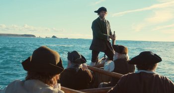 Movie still from “Portrait of a Lady on Fire” (2019), directed by Céline Sciamma – A group of people on a boat in the ocean; Wide shot, High angle