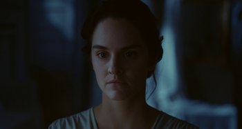 Movie still from “Portrait of a Lady on Fire” (2019), directed by Céline Sciamma – A person wearing a white shirt; Close Up shot, Low angle