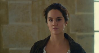 Movie still from “Portrait of a Lady on Fire” (2019), directed by Céline Sciamma – A person wearing a black jacket; Close Up shot, Over the shoulder angle