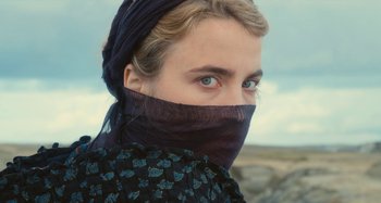 Movie still from “Portrait of a Lady on Fire” (2019), directed by Céline Sciamma – A person with a scarf covering their face; Close Up shot, High angle