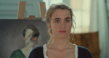 Movie still from “Portrait of a Lady on Fire” (2019), directed by Céline Sciamma – A young woman is standing in front of an easel; Close Up shot, Over the shoulder angle