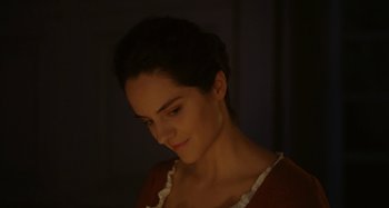 Movie still from “Portrait of a Lady on Fire” (2019), directed by Céline Sciamma – A young woman with dark hair is looking at the camera; Close Up shot, Over the shoulder angle