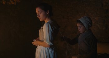 Movie still from “Portrait of a Lady on Fire” (2019), directed by Céline Sciamma – A young girl in a white dress and a young girl in a white dress; Medium shot, Low angle