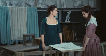 Movie still from “Portrait of a Lady on Fire” (2019), directed by Céline Sciamma – A woman standing in front of an easel in an art studio; Medium shot, Over the shoulder angle