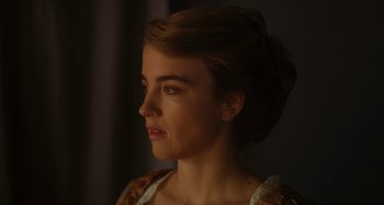 Movie still from “Portrait of a Lady on Fire” (2019), directed by Céline Sciamma – A beautiful young lady looking to the side; Close Up shot, Over the shoulder angle